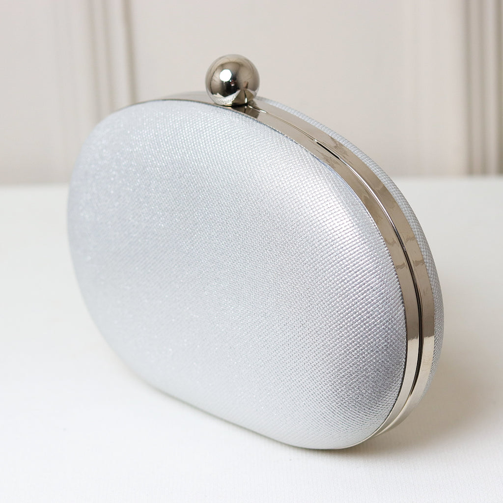 CLUTCH BRILHO TEXTURA FORMATO OVAL FECHO ESFERA