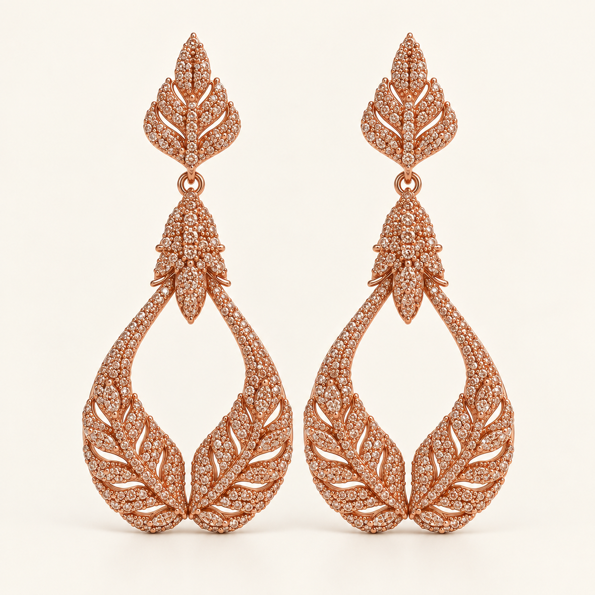 BRINCO FESTA ROSÉ CRAVEJADO ZIRCÔNIA RAMO DE FOLHA VAZADO